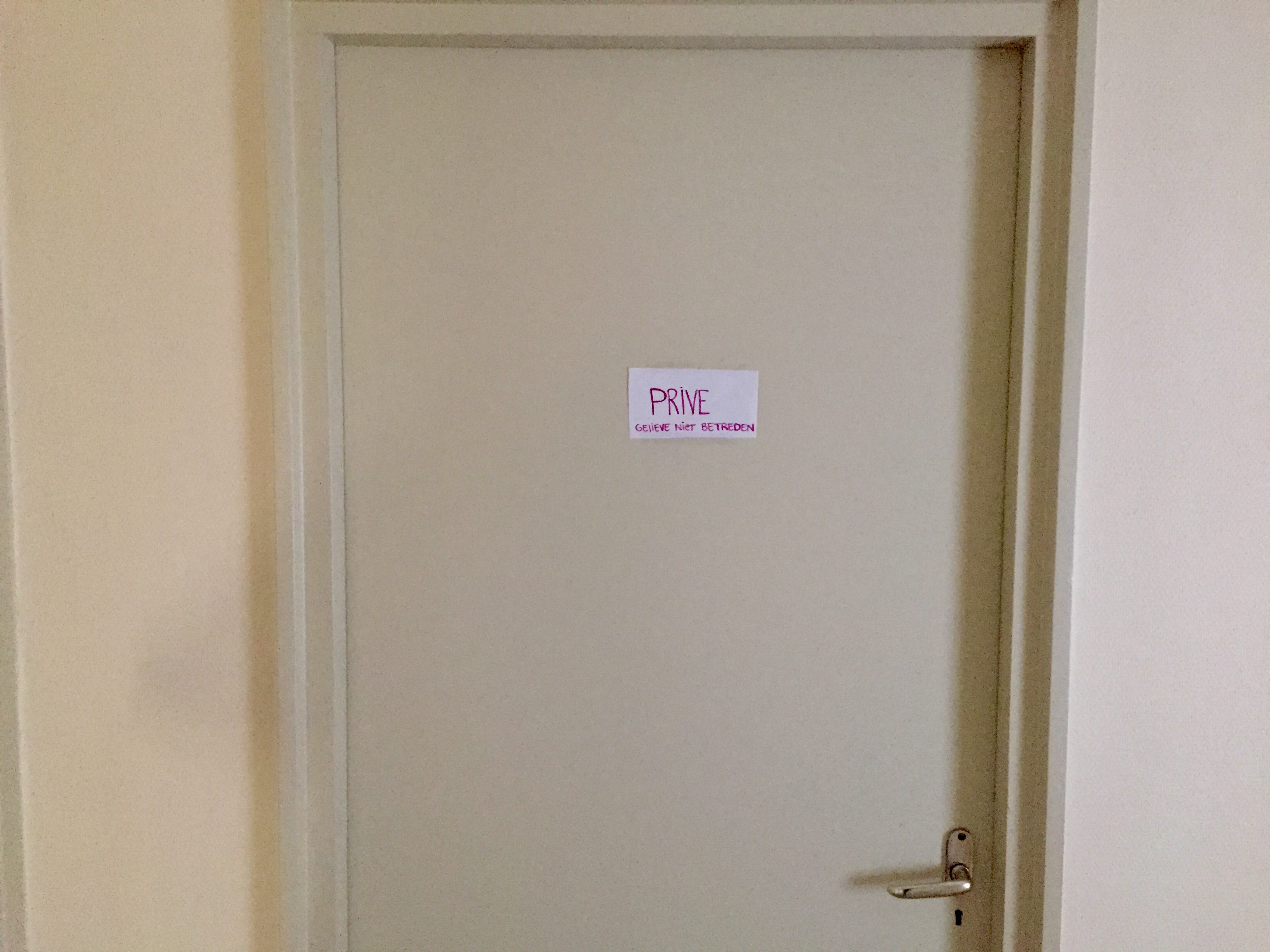 The bedroom door, with a note that says “Please do not enter"